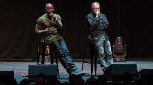 An image of Dave Chapelle on stage.